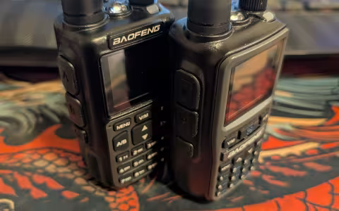 A Baofeng UV-5R mini side by side with a Baofeng UV-5R Mini-5